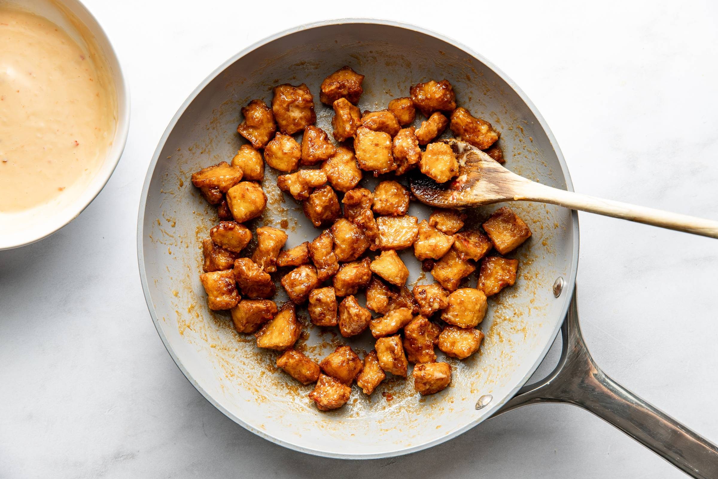 Tofu and sauce in skillet.