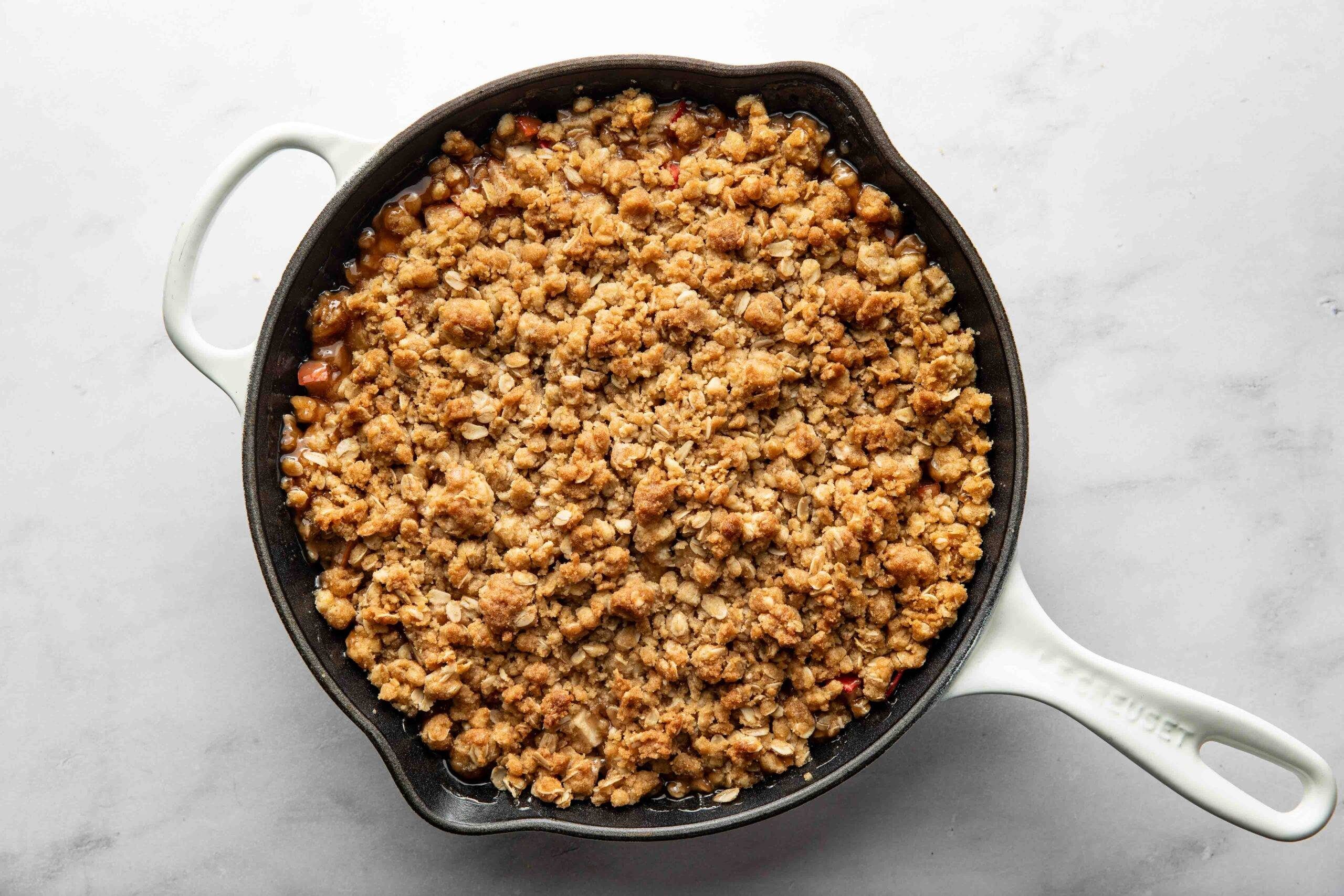 Finished apple crisp in a skillet.