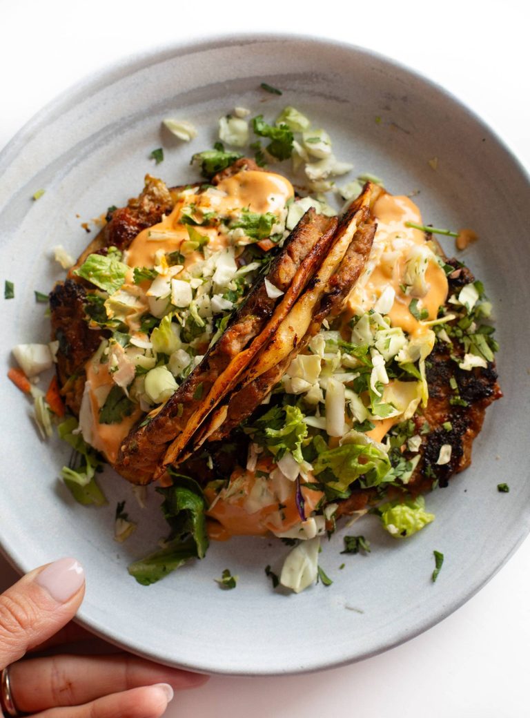 Egg roll tacos on a plate.