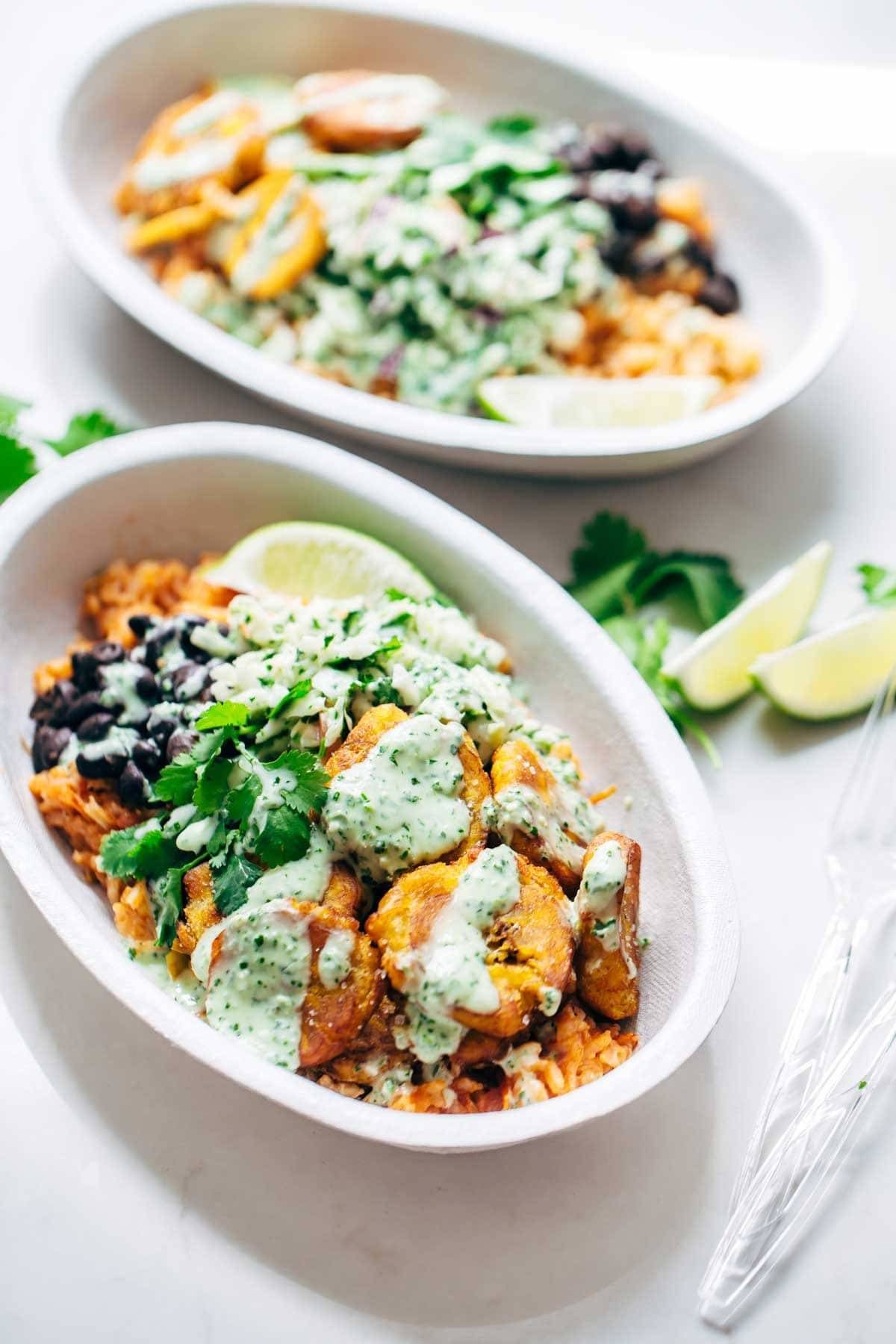 Spicy Brazilian Burrito Bowls recipe featuring seasoned rice and beans, garlic cilantro lime slaw, and crispy fried plantains. So good // almost vegan. | pinchofyum.com