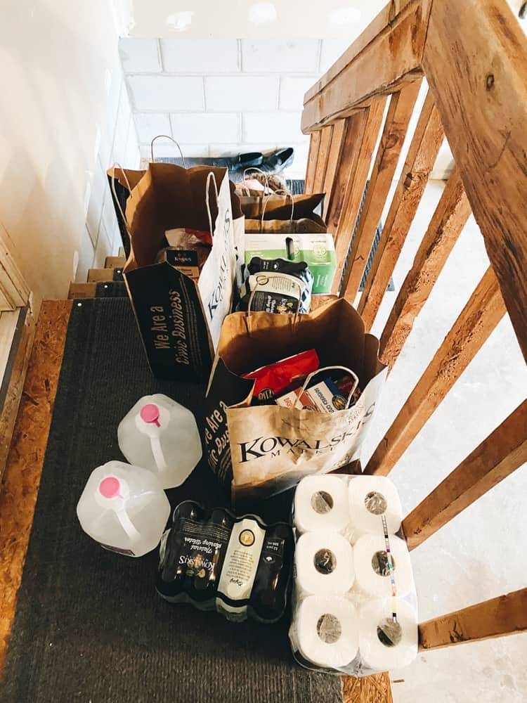 A staircase with various grocery items.