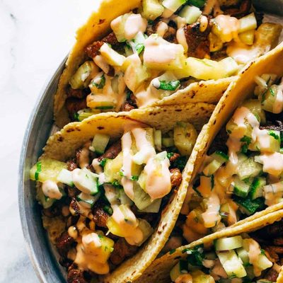 A picture of Caramelized Pork Tacos with Pineapple Salsa