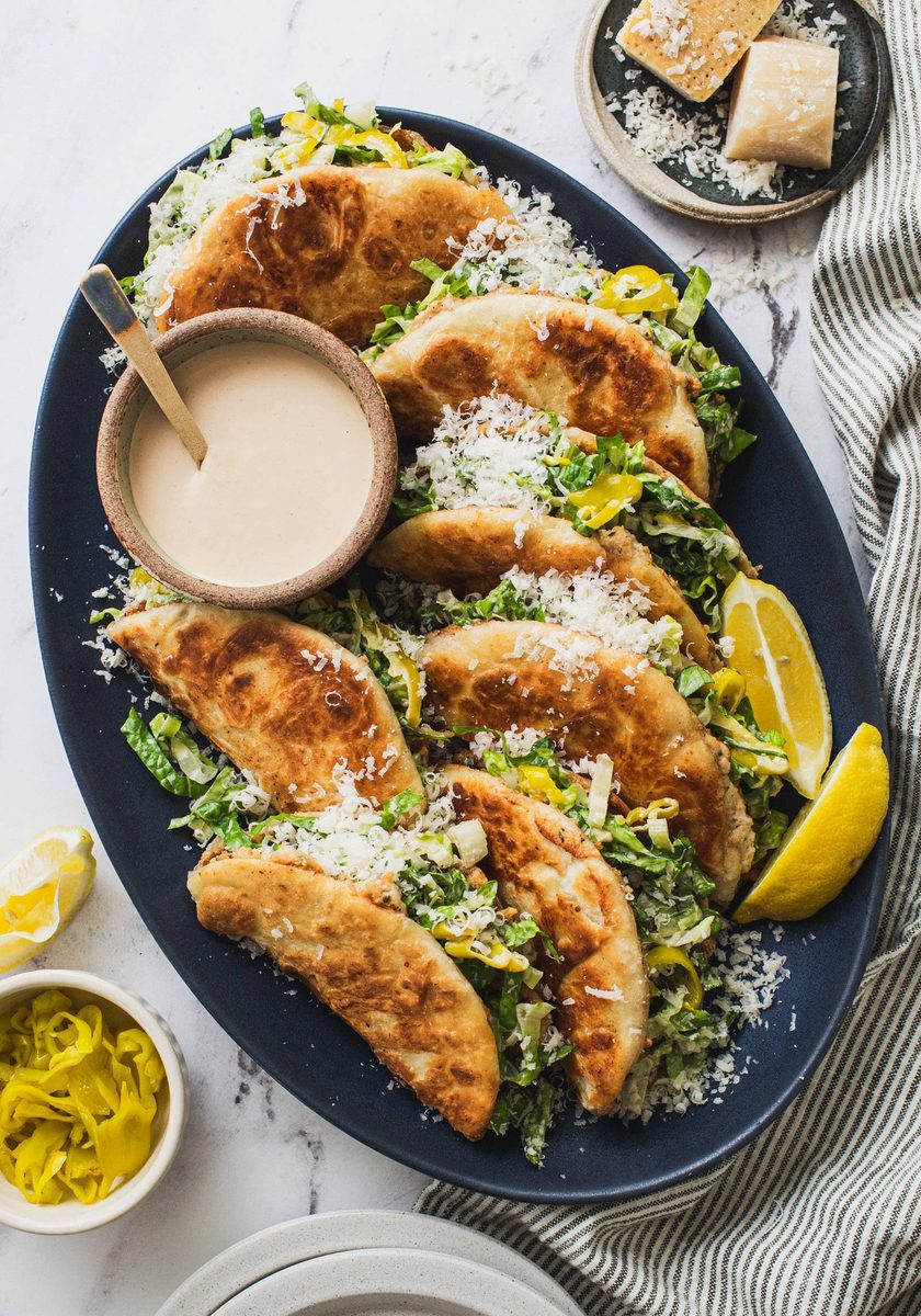 Caesar smash tacos on a plate.