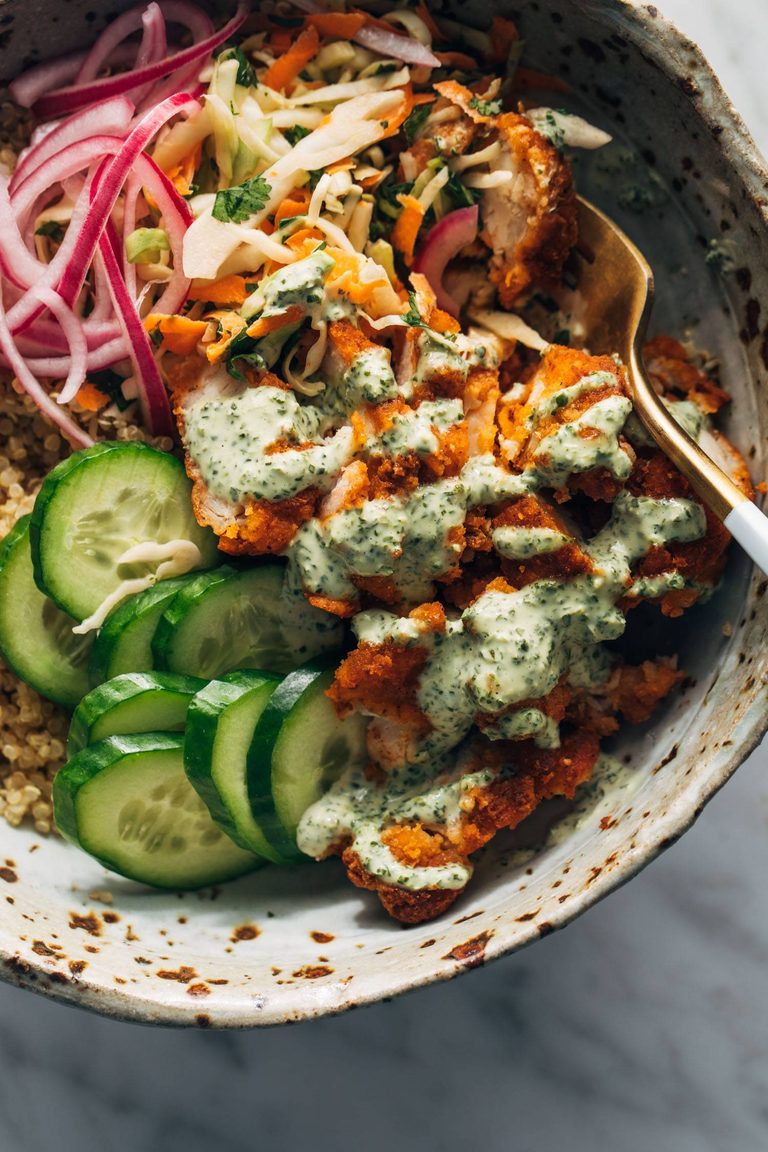 Crispy chicken tikka in a bowl with cucumbers.