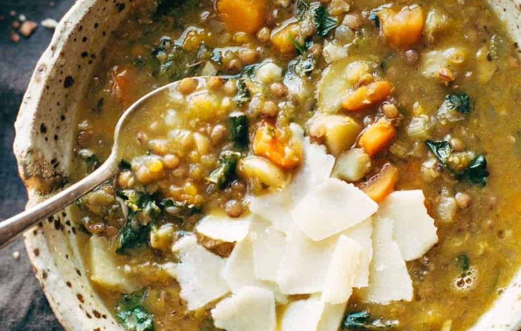 Detox Crockpot Lentil Soup in bowl with a spoon.