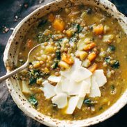 Detox Crockpot Lentil Soup in bowl with a spoon.