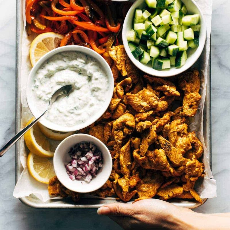 A picture of Sheet Pan Chicken Pitas with Tzatziki