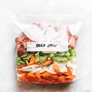 Beef stew ingredients in a plastic bag.
