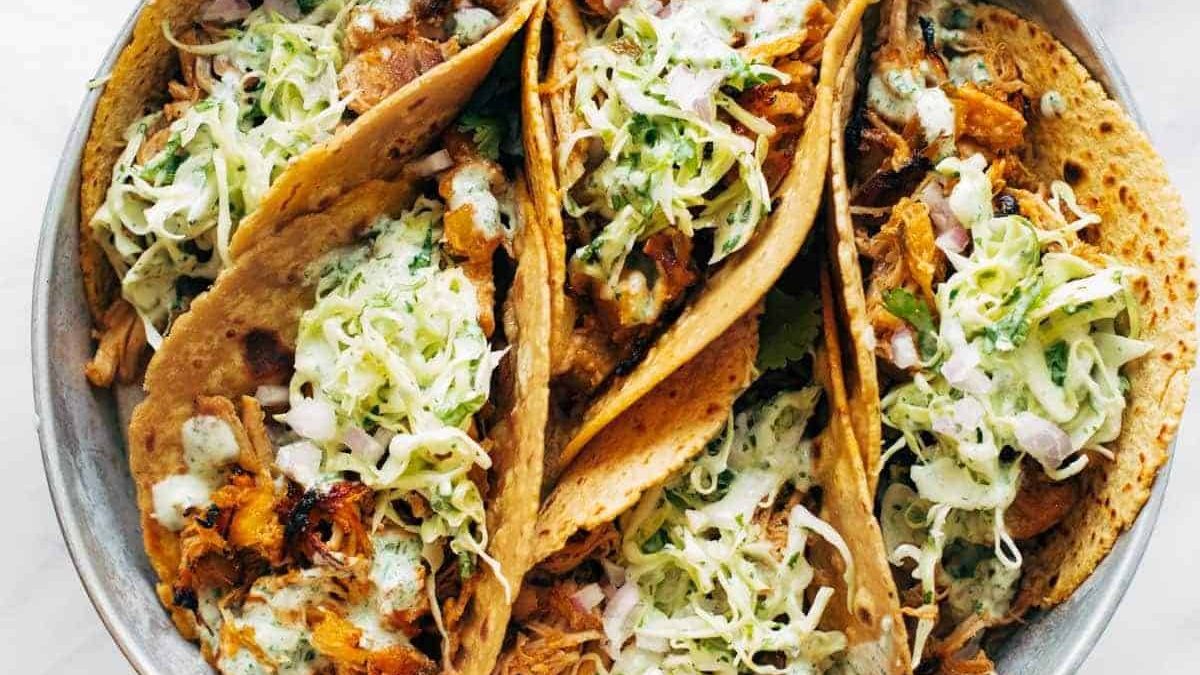 Chicken tacos on a plate.