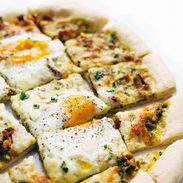 A picture of Breakfast Pizza with Kale Pesto and Sun Dried Tomatoes