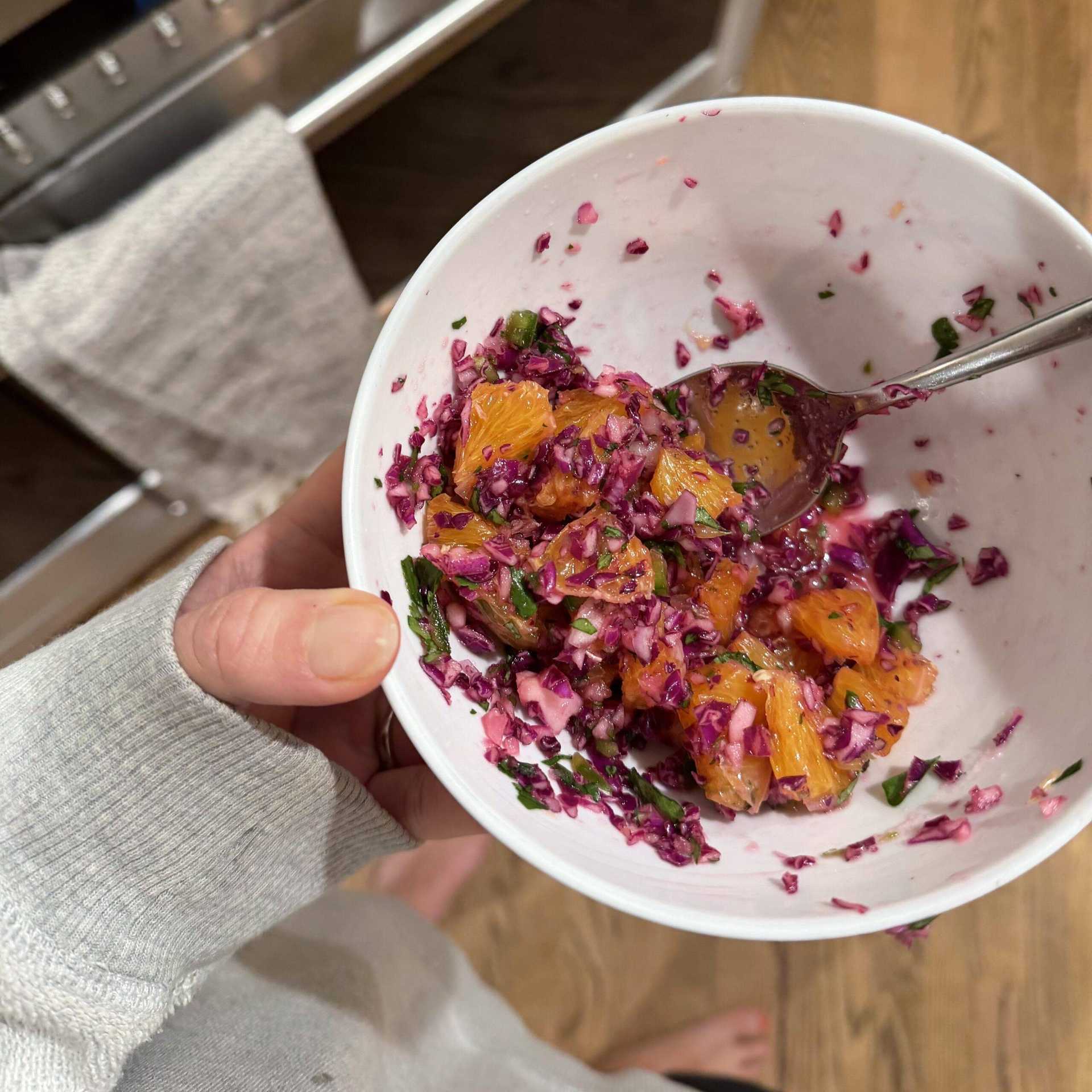 Orange salsa in a small bowl.