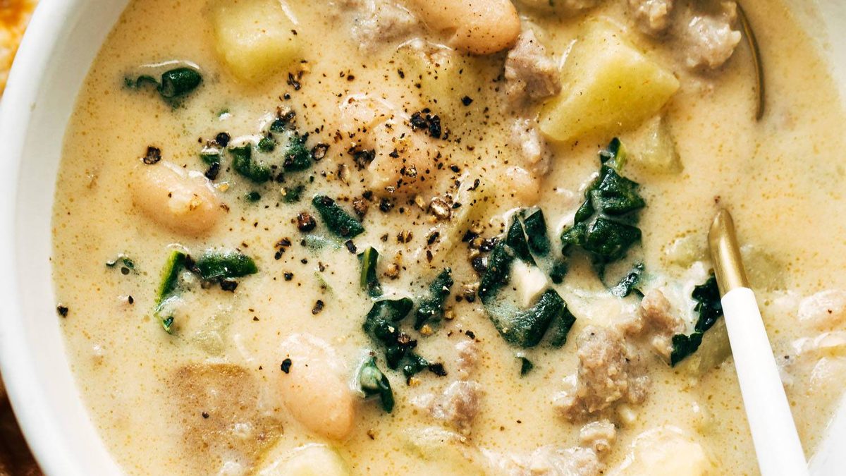 Sausage and white bean soup in a bowl.