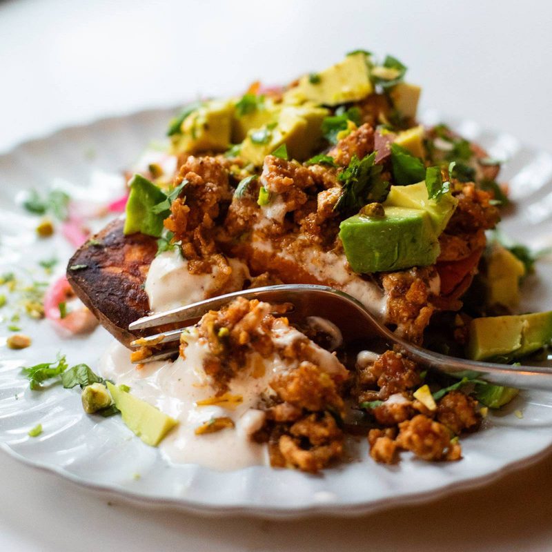 Roasted sweet potato stack with chipotle sauce on a plate