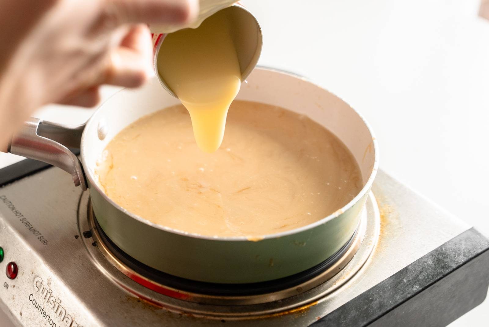 Cook the caramel coating on the stove.