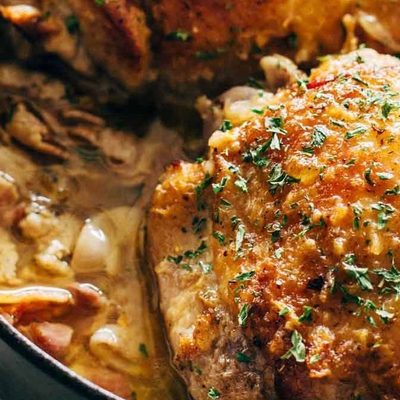 Skillet Turkey with Bacon and White Wine in a pan.