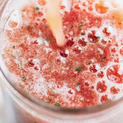 Watermelon Smoothie being poured into a glass.