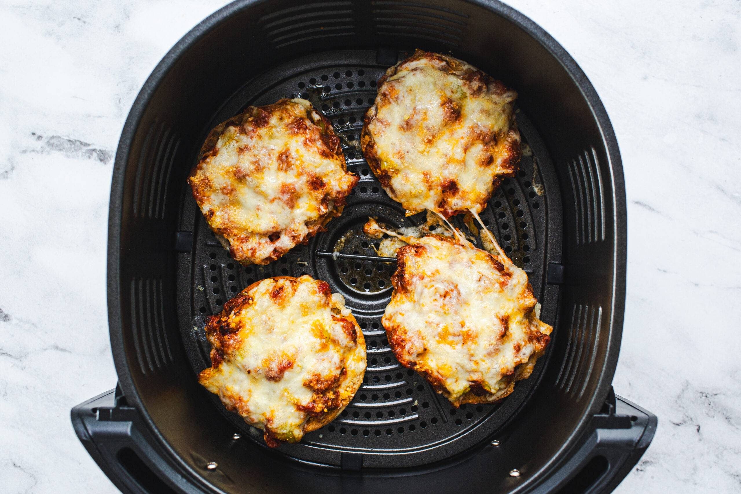 Pizza burgers in an air fryer.