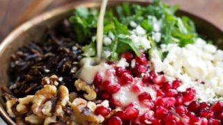 Pomegranate, Kale, and Wild Rice Salad with Walnuts and Feta - a perfect way to freshen up the table this Thanksgiving! | pinchofyum.com
