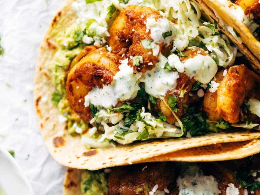 Shrimp tacos with sauce.