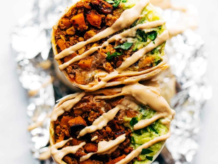 Vegan mega-burrito with vegan queso.