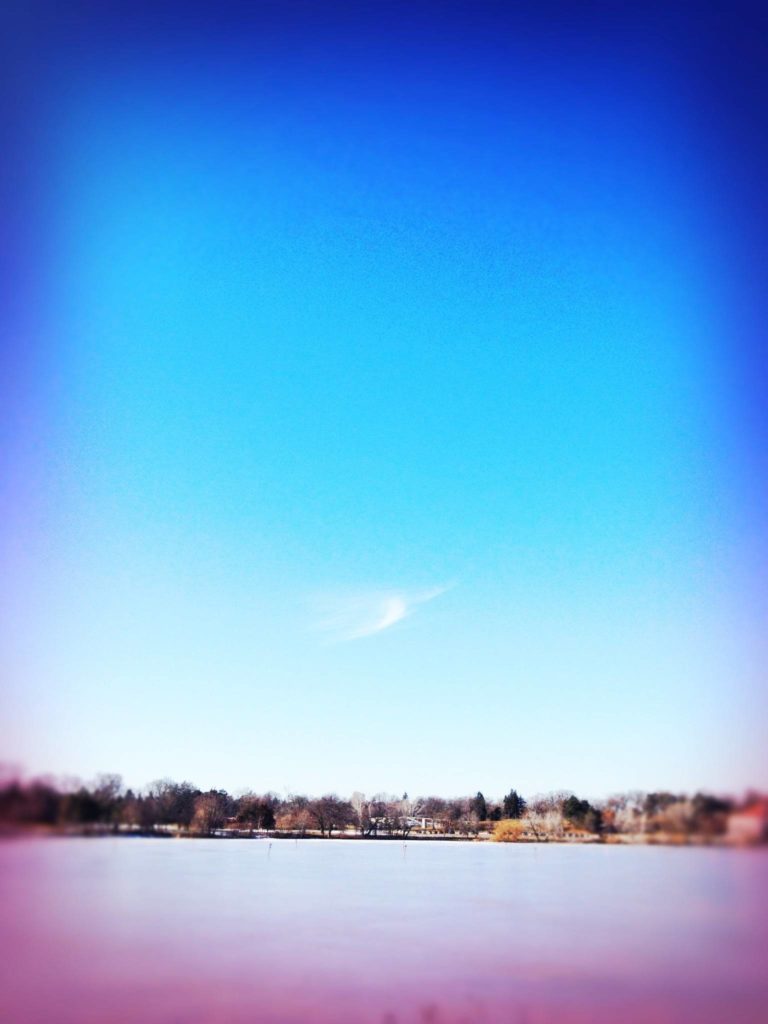 Blue sky over lake.