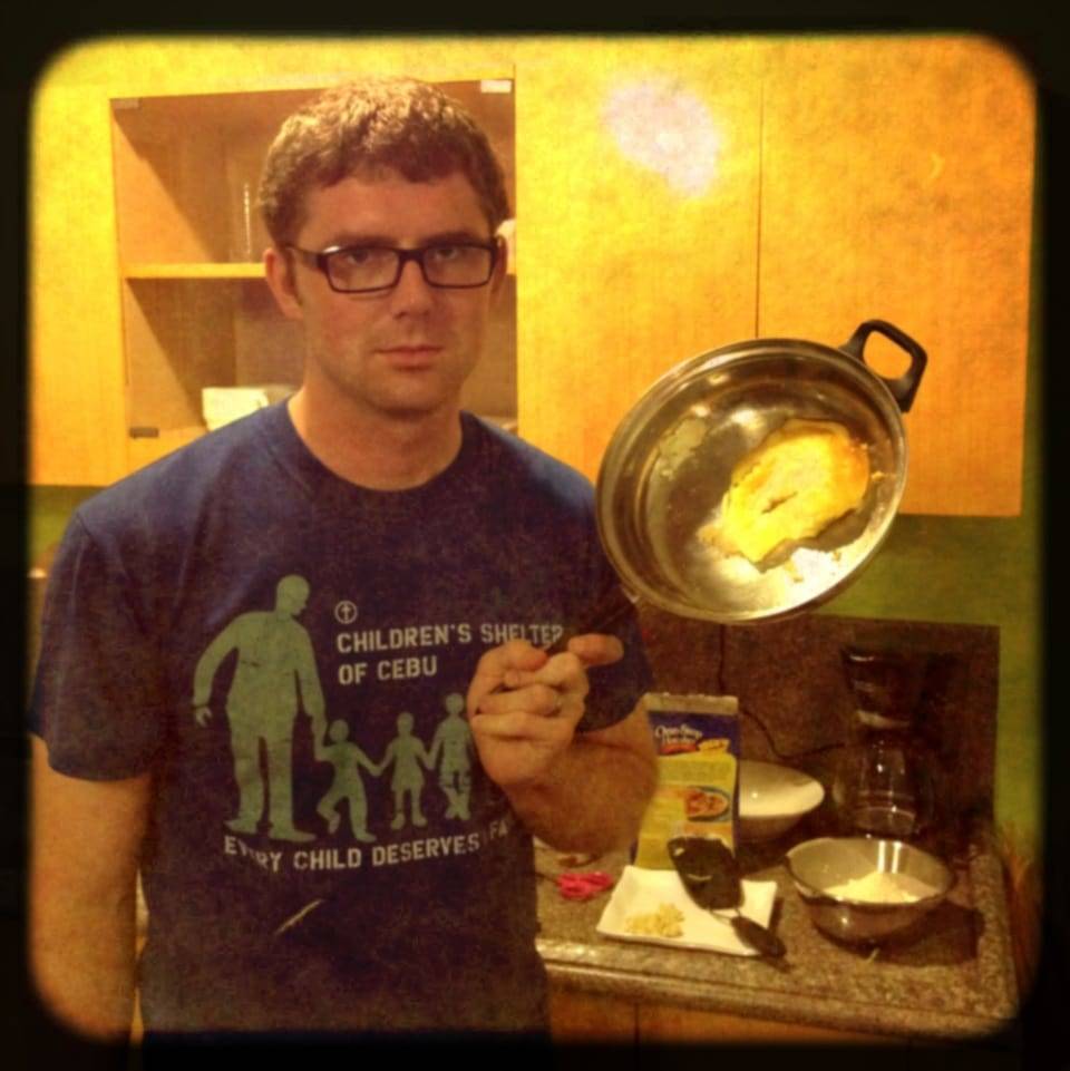 Man holding a pan.