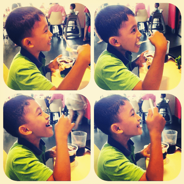 Young boy eating.