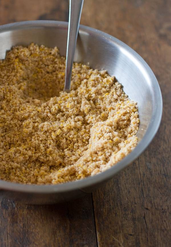 Crust in a steel bowl with a spoon.