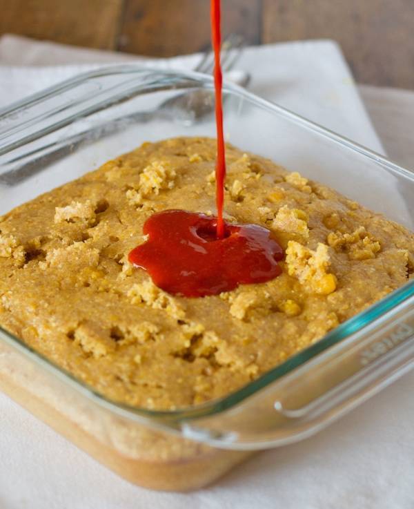 Pie with drizzle in a clear baking dish.