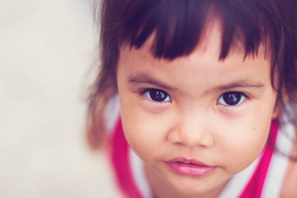 Young girl looking into the camera.