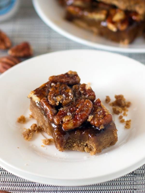Salted pecan pie bar on a plate.