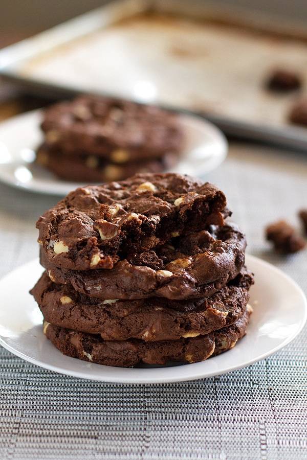 Double chocolate cake mix cookies stacked on each other.