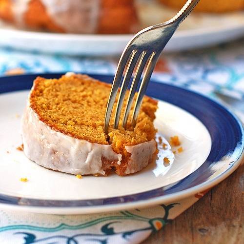 Pumpkin bundt cake with a fork on a plate.