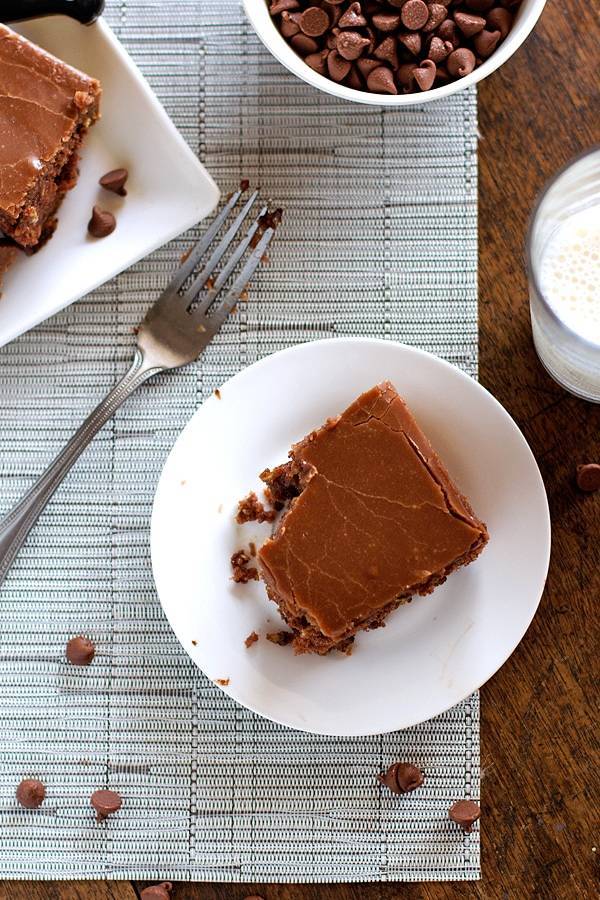 Chocolate oatmeal cake slice on a white plate.