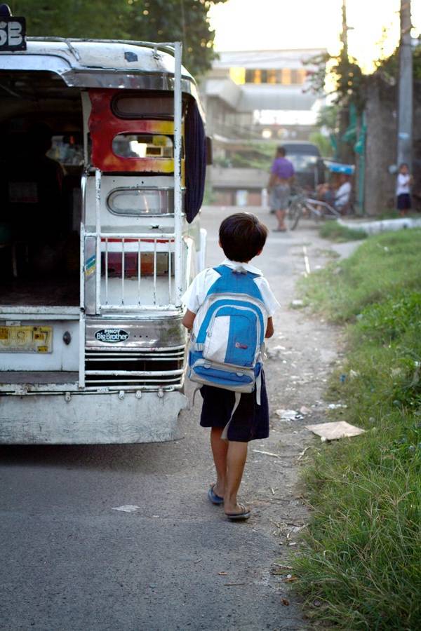 Boy walking on the street.