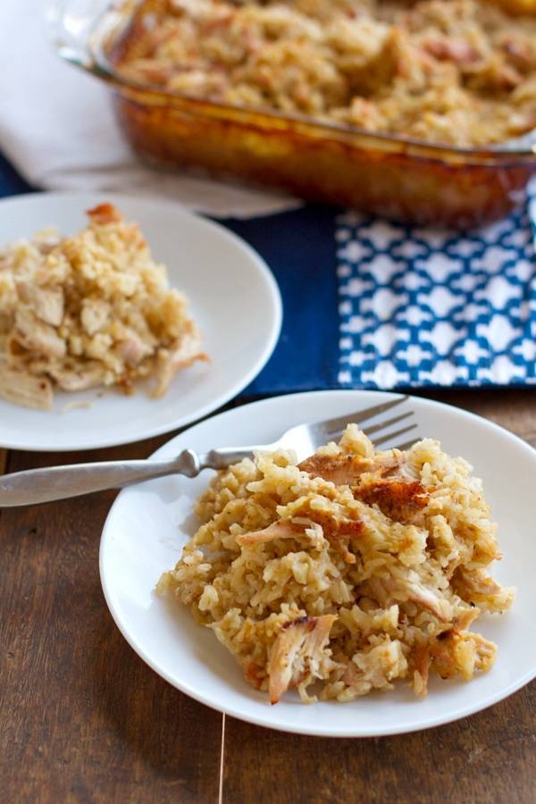 Chicken and rice casserole on two white plates.