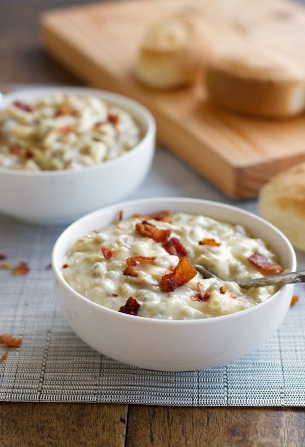 Chicken bacon wild rice soup in two white bowls.