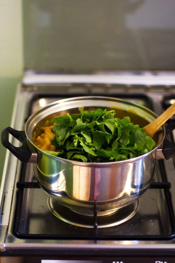 Spinach in a pot on the stove.