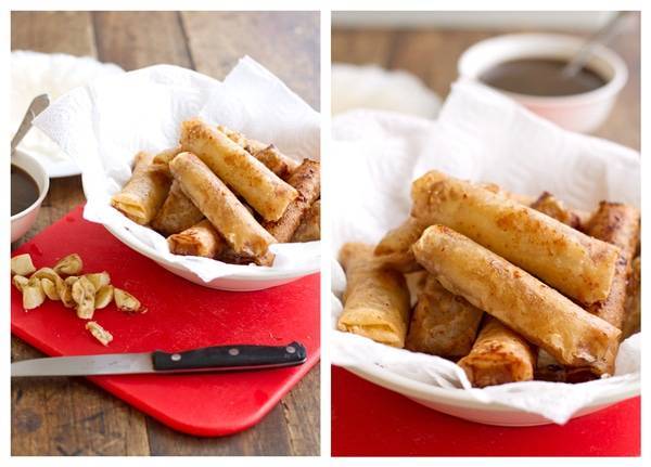 Banana lumpia in a bowl on a red cutting board.