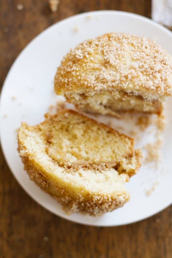 Coffee cake muffin on a white plate.