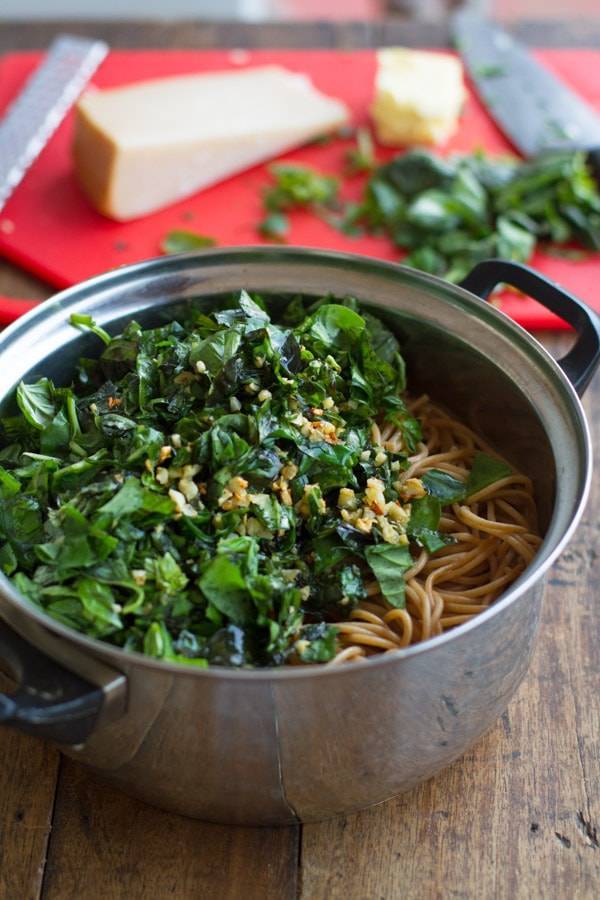 Garlic butter spaghetti with herbs in a pot.