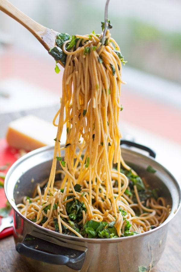 Garlic butter spaghetti with herbs in a pot.