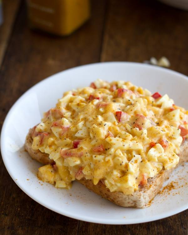 Curry egg salad on a piece of bread.
