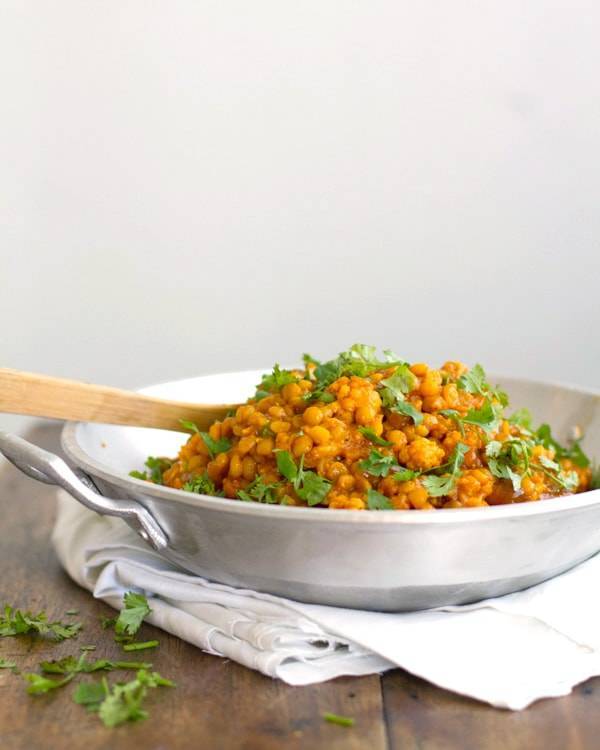 Cauliflower yellow lentil curry in a skillet.