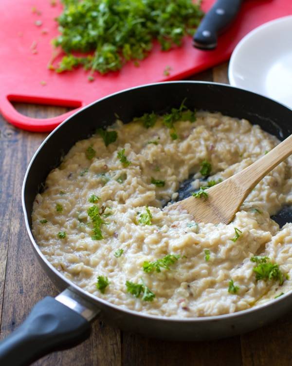 This creamy cauliflower garlic rice is simple, healthy, and so surprisingly good! With garlic, butter, brown rice, and cauliflower. | pinchofyum.com