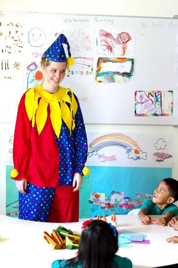 Woman wearing a clown costume.