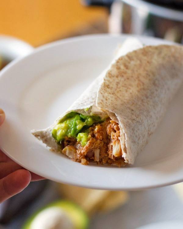 Mexican chicken and pinto beans in a tortilla.