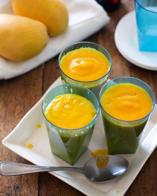 Papaya mango smoothies in blue cups.