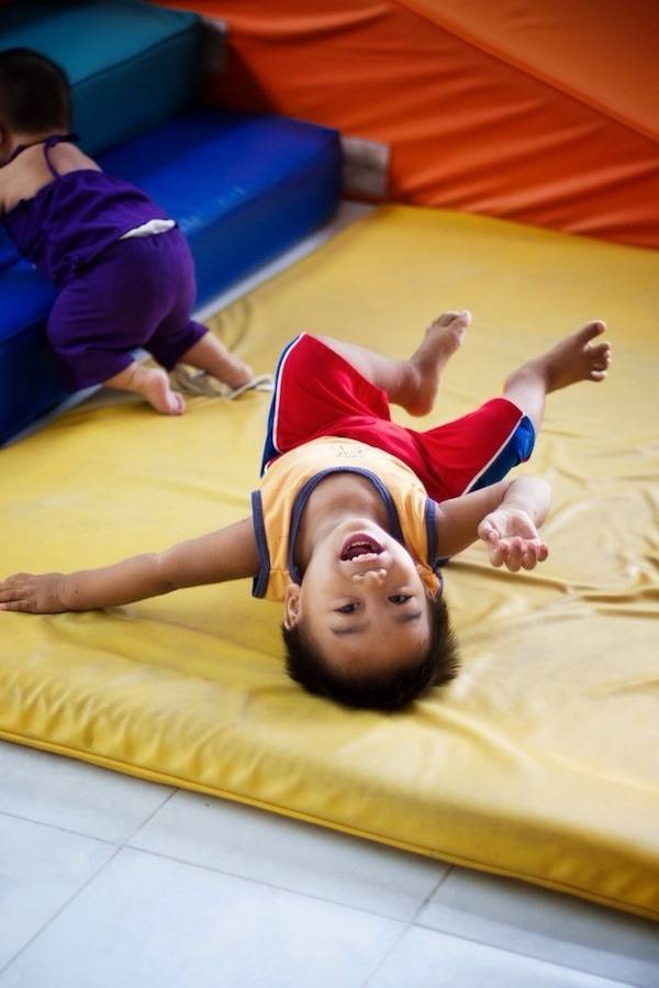 Young boy on a play mat.