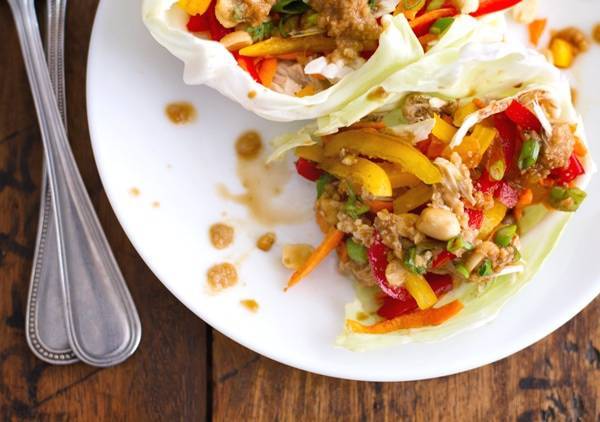 Thai chicken lettuce wraps on a plate.
